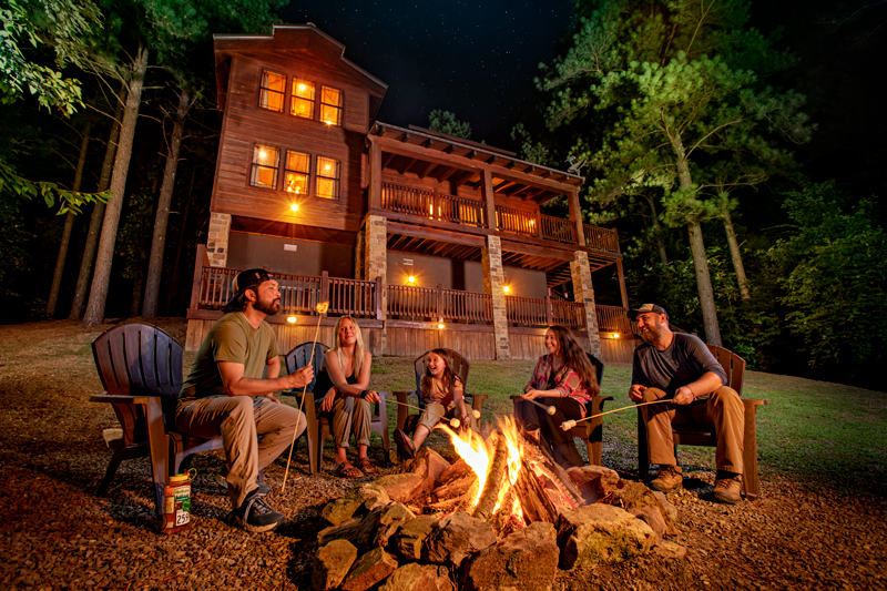 Family with Campfire in Beavers Bend Cabin Country
