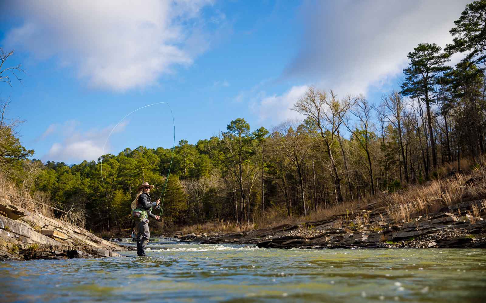 Morgan "Mo" Prater fly fishing for rainbow and brown trout on the Lower Mountain Fork River in Beavers Bend. Winter fishing.