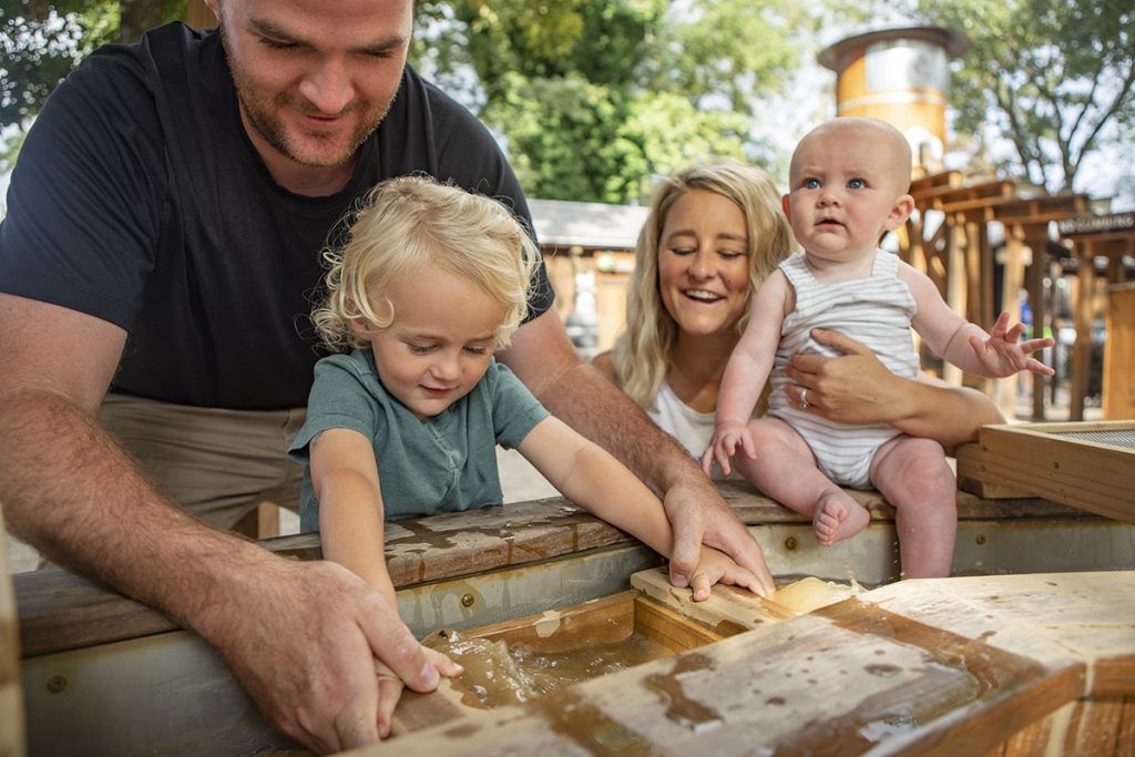 A family mines for gems at the Hochatown Mining Company in Hochatown, Oklahoma, one of the many outdoor activities that are fun for kids of all ages.