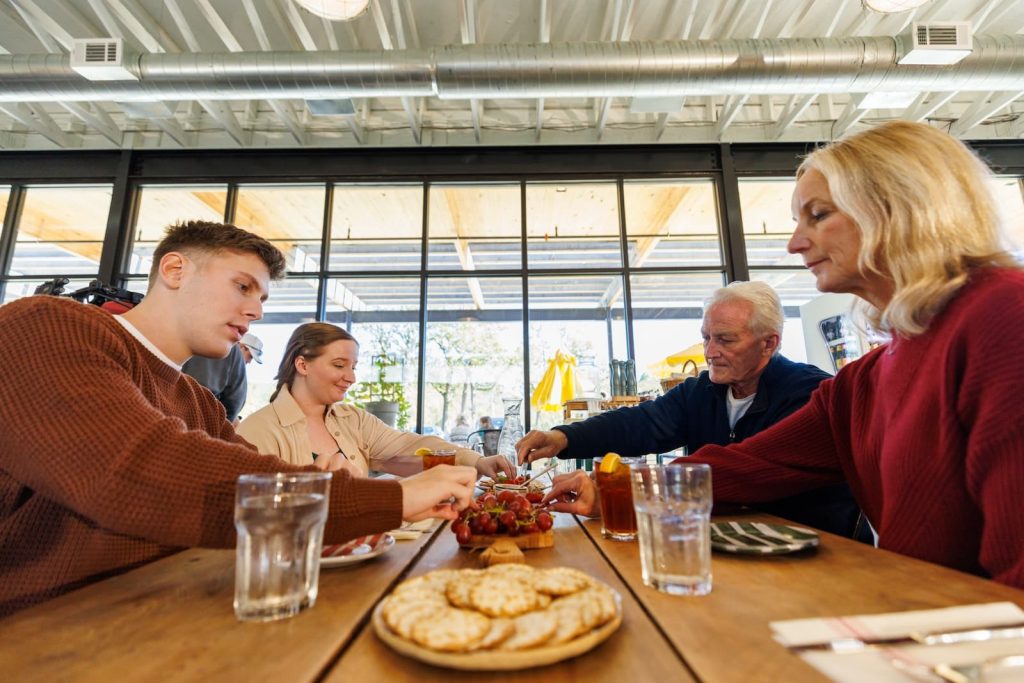 An older family eats at a restaurant in Beavers Bend Cabin Country.