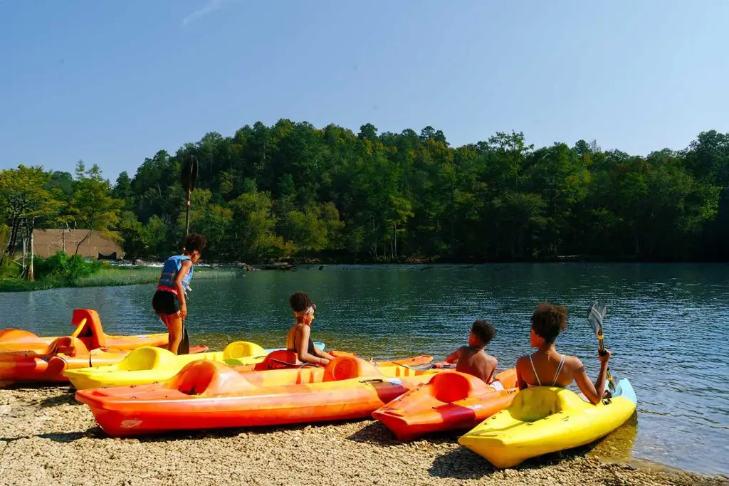 No summer guide would be complete without kayaks. A family gets ready to paddle the Lower Mountain Fork River on their rented kayaks in Beavers Bend State Park